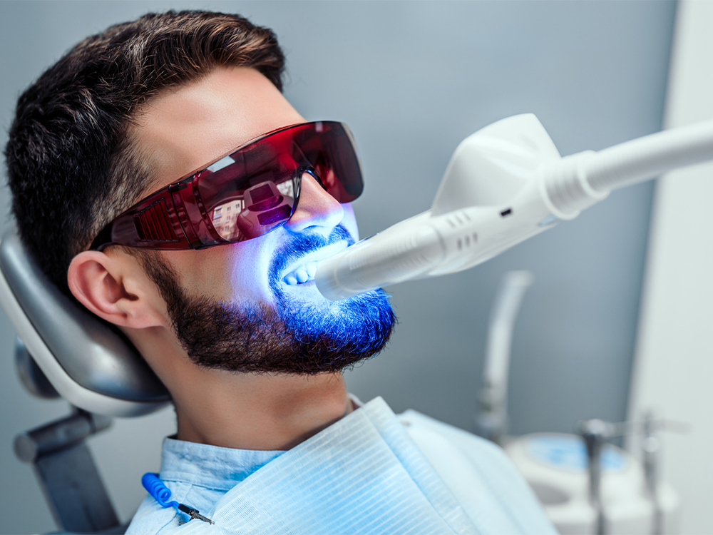 male patient getting his teeth whitened